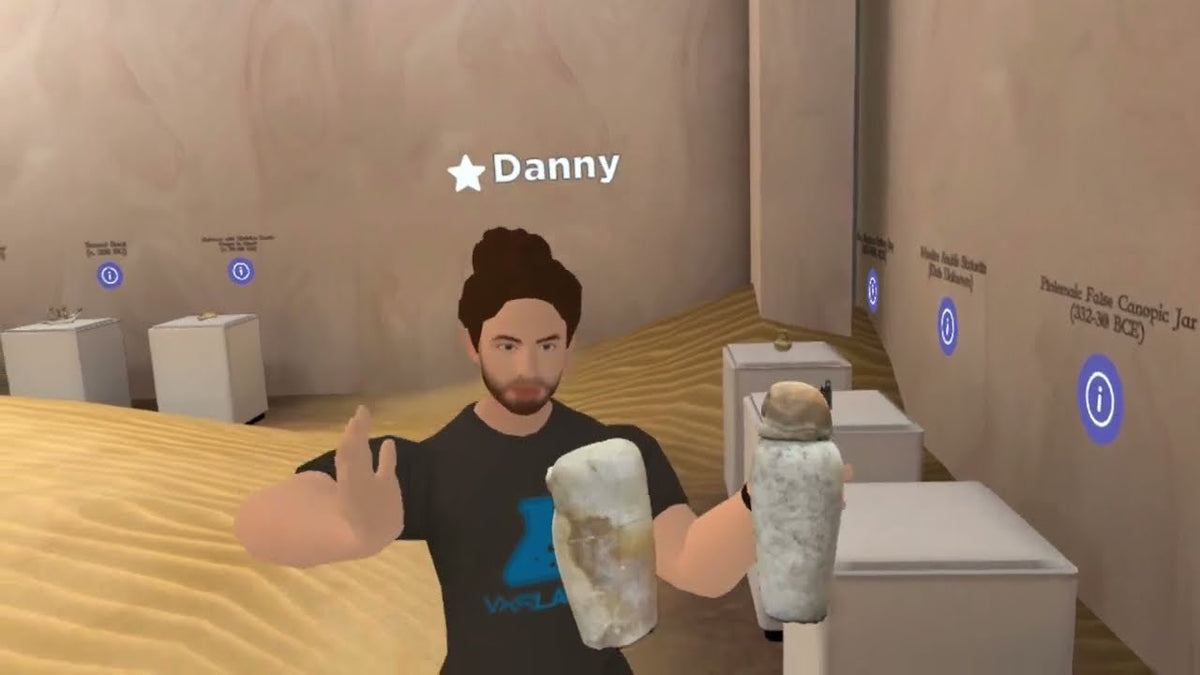 An avatar examining artifacts in a virtual museum